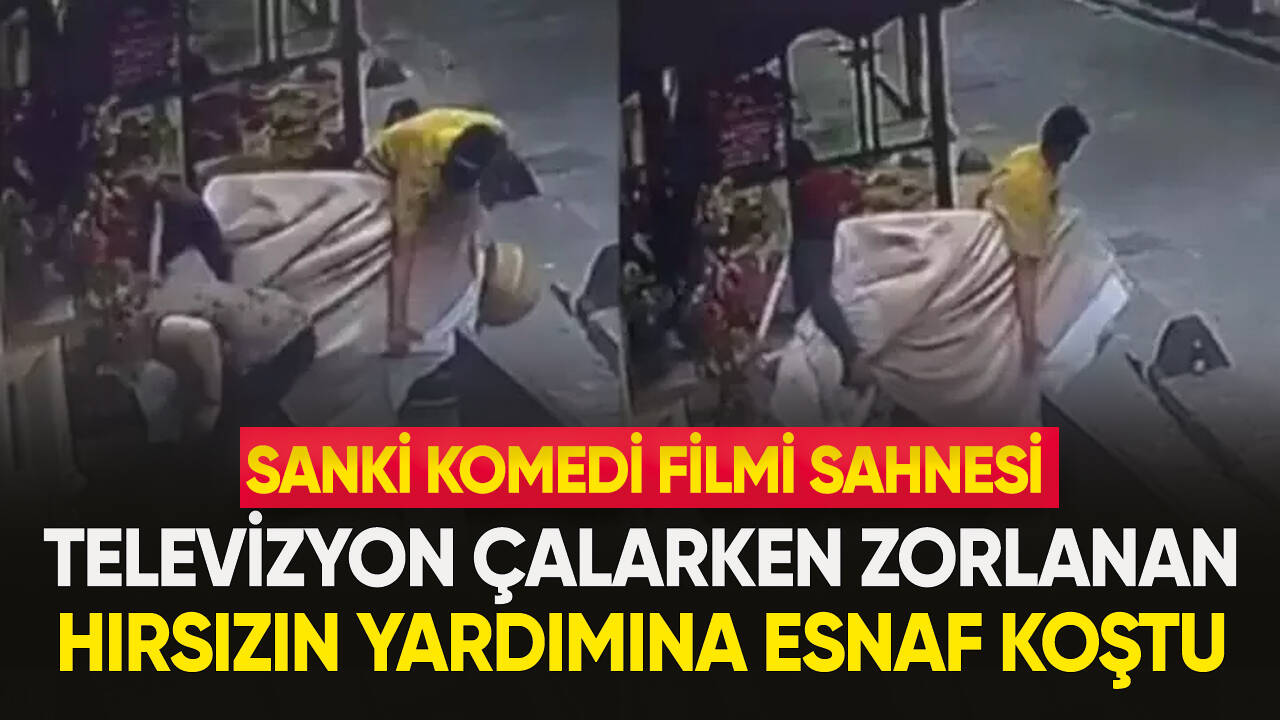 Yardımsever esnaf, hırsıza televizyon çalarken yardım etti