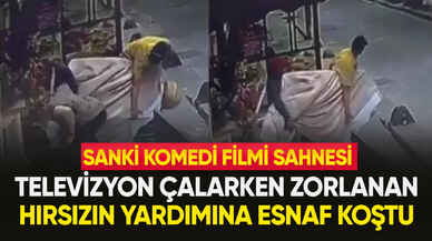 Yardımsever esnaf, hırsıza televizyon çalarken yardım etti