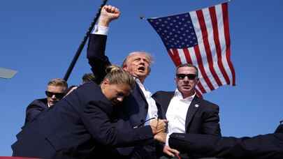 Trump kanlı fotoğrafıyla destekçilerini birlik ve barışa çağırıyor